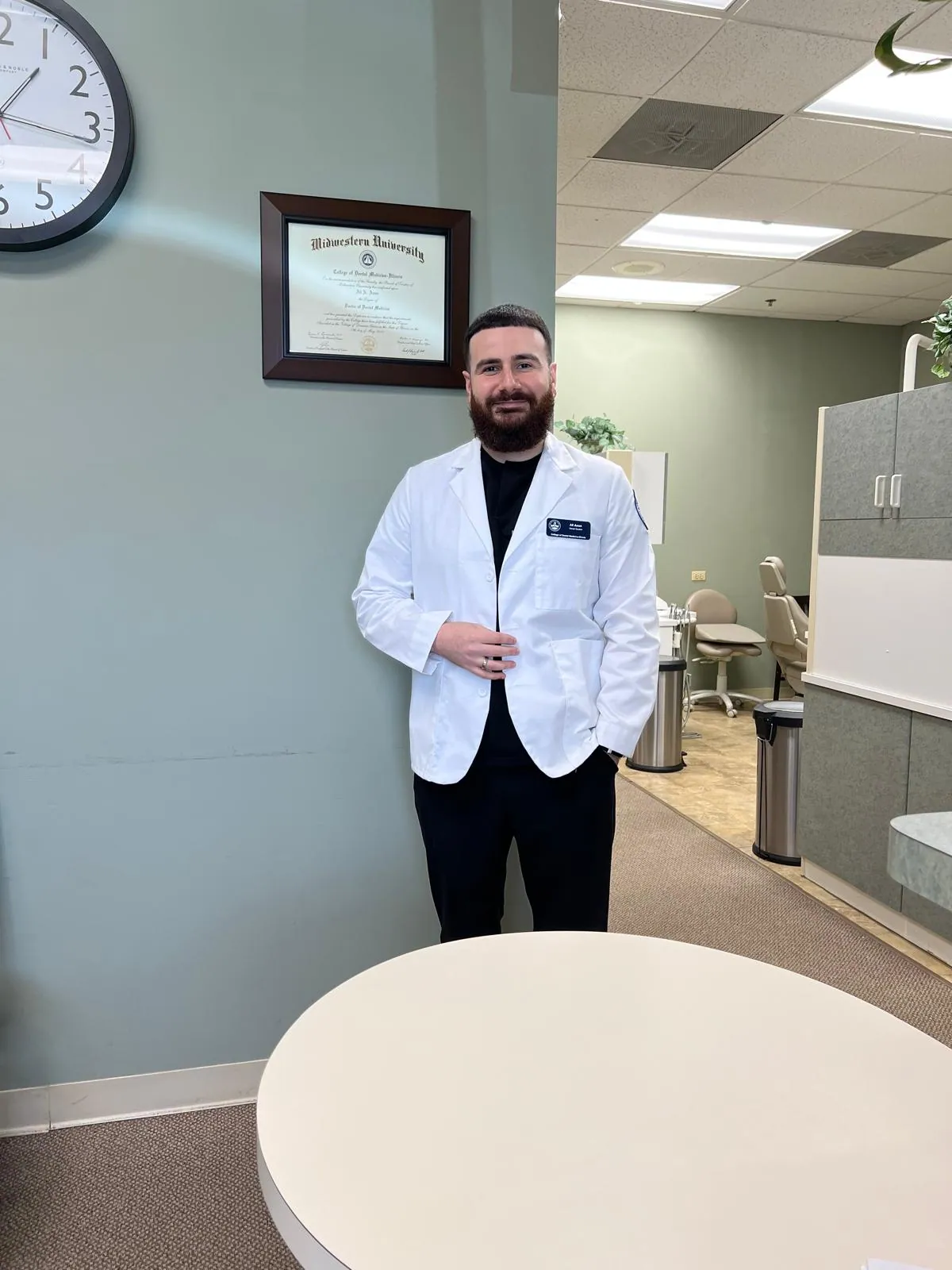 Dr. Ali Aoun standing inside the Urban Dental Care office in Woodridge